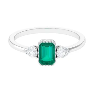 Octagon shape Emerald and Diamond Three Stone Ring in Bezel Setting